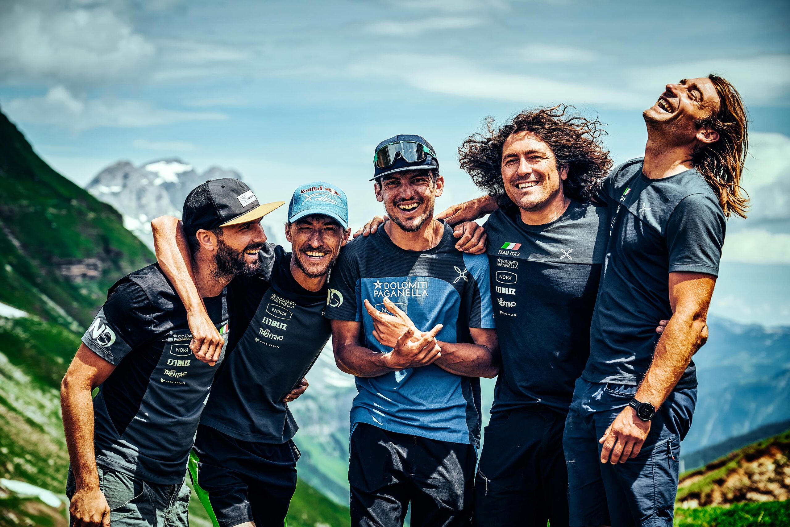 Nicola Donini embracing supporters Marco Recchia, Fiorenzo Graziano, Bernardo Zeni and Marco Diliberto at finish of Red Bull X-Alps 2021 — Vulnerability documentary by Uptelling